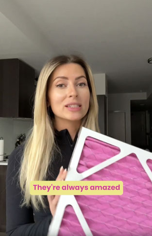 Customer holding their pet next to a Colorfil air filter