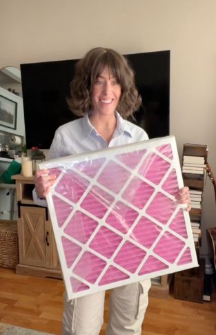 Customer holding their pet next to a Colorfil air filter